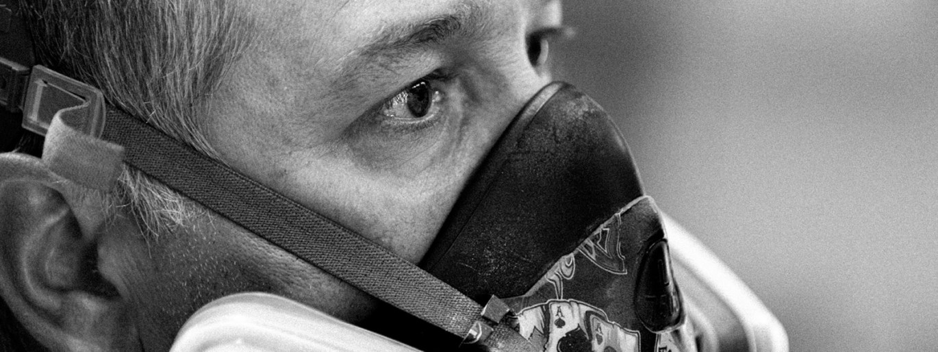 person working on the creation of the Look bindings wearing a mask